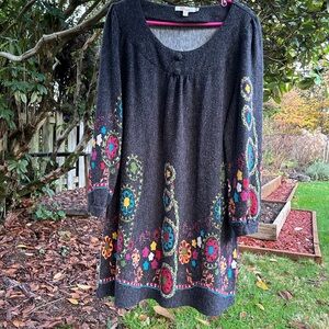 Aryeh Boho dress charcoal with floral print trim. Long sleeves swoop collar.